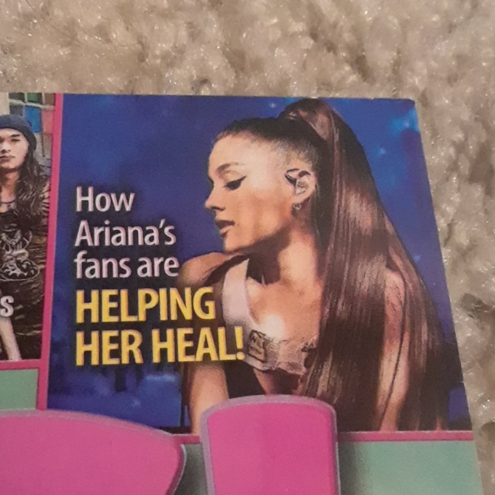 A magazine with Ariana Grande in it